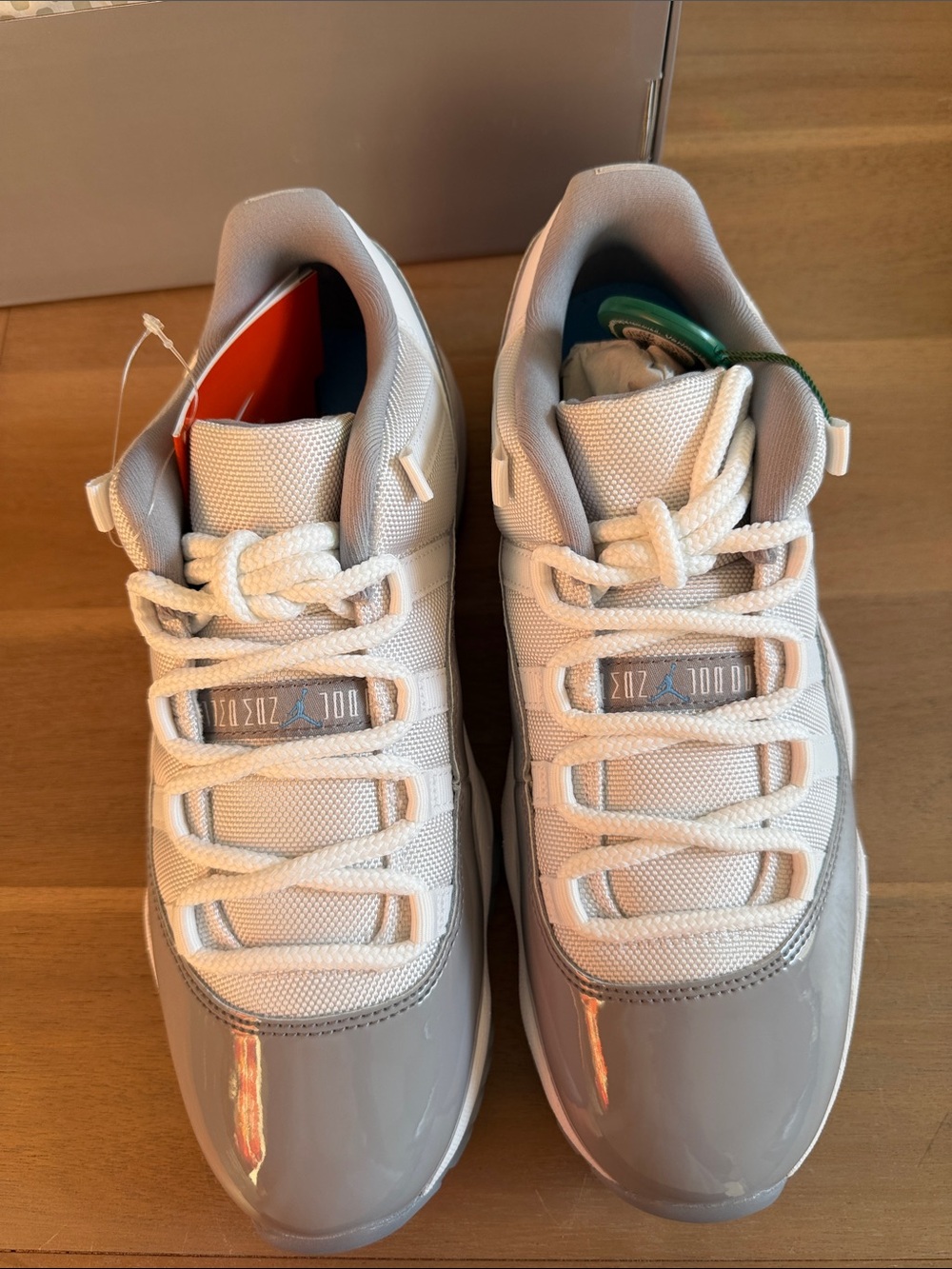 Jordan Mens Retro 11 Low Top Sneakers in White and Gray